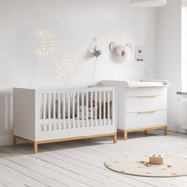 Nursery furniture set with convertible cot bed and baby changing table in white from Petite Amélie
