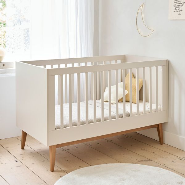 Convertible cot bed in beige with a minimalist style, perfect for modern nurseries from Petite Amélie