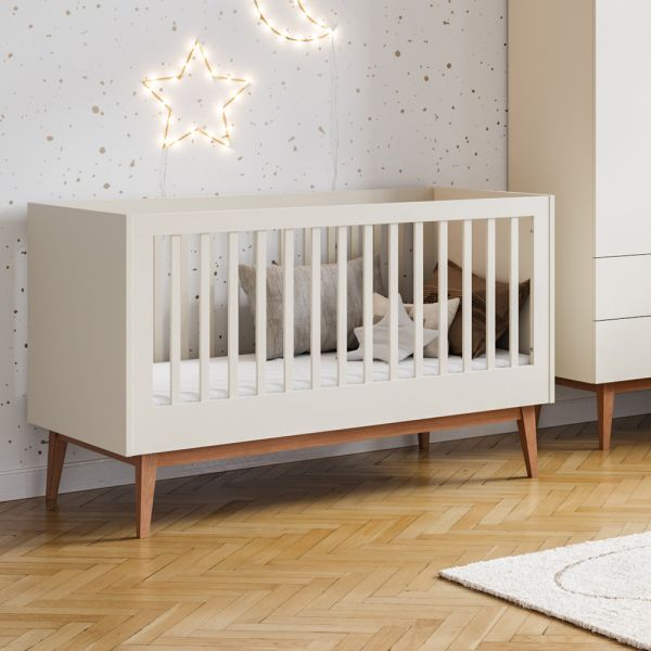 Convertible cot bed in beige with a minimalist style, perfect for modern nurseries from Petite Amélie
