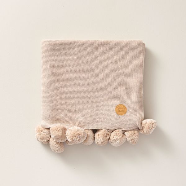 sandy rose coloured pom pom baby blanket petite amelie