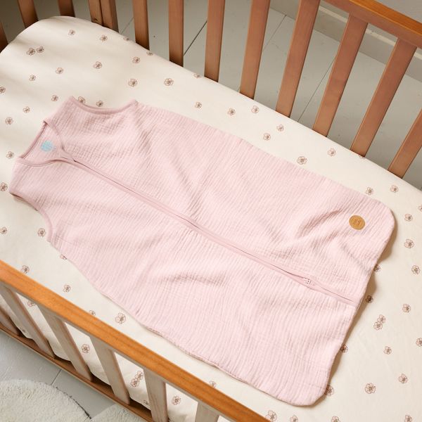 Sleeveless sleeping bag in pink muslin for 3 to 6 months from Petite Amélie 