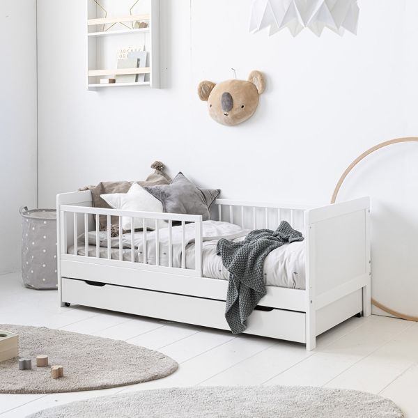 white toddler bed with removable drawer