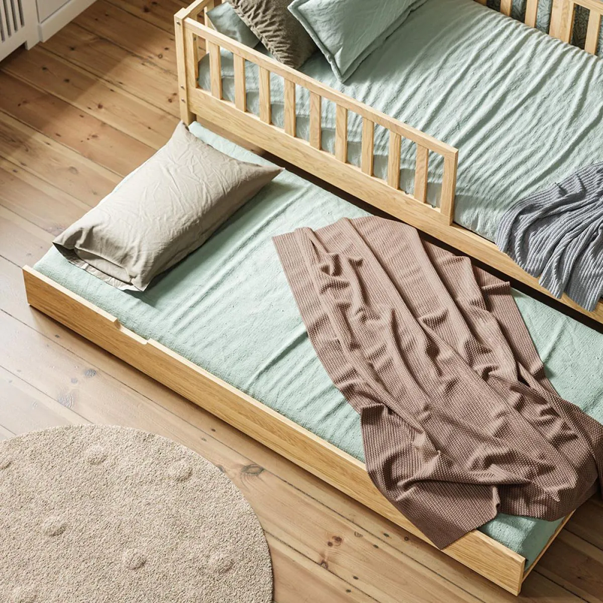 Trundle bed natural wood finish by Petite Amélie
